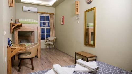 a bedroom with a bed and a desk and a desk at Second Home Suites in Istanbul