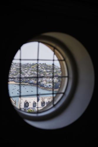 a view of a city from a window at Fowey Hall Hotel in Fowey