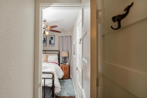 a bedroom with a bed and a ceiling fan at CDM 314 - Buoy Oh Buoy! in Galveston