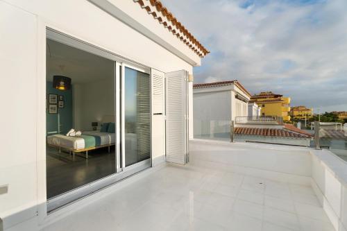 a balcony with a view of a bedroom at Espectacular Villa Aurora By Paramount Holidays in Puerto de Santiago