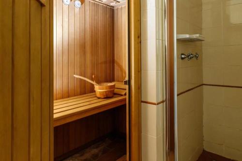 a shower with a wooden shelf in a bathroom at Agriturismo Podere Bucine Basso in Lari