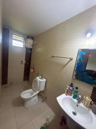 a bathroom with a toilet and a sink at Formosa siolim in Old Goa