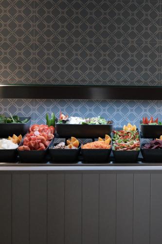 a buffet line with bowls of different types of food at Prinsotel Alba & Spa in Cala d´Or