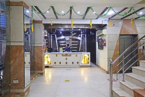 a room with a stage in a building with lights at Hotel Ratandeep at Paharganj in New Delhi