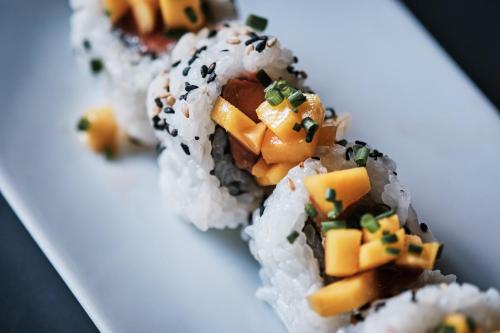 a plate of sushi with rice and vegetables on it at Prinsotel Alba & Spa in Cala d´Or