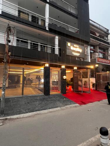 a building with a red carpet in front of it at Hotel Grey Sky in New Delhi