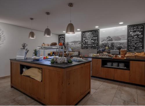 a kitchen with a counter with food on it at Pension Zenzlgut in Tiefgraben