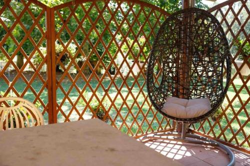 a bird cage sitting on top of a table at Agriturismo Podere Bucine Basso in Lari