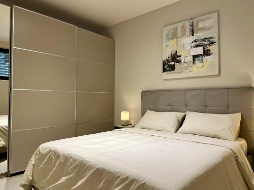 Ένα ή περισσότερα κρεβάτια σε δωμάτιο στο Lago Style Apartment