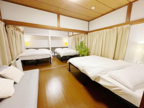 A bed or beds in a room at 【2024/2月OPEN! 一軒家貸切】東京ディズニーリゾートまで車5分、徒歩20分