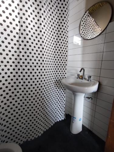 a bathroom with a sink and a mirror at CABAÑAS RIVIERA in Huacalera