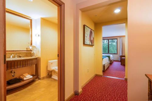 a bathroom with a sink and a toilet and a mirror at Cozy, Luxury, Affordable Suncadia Lodge Hotel Room in Cle Elum