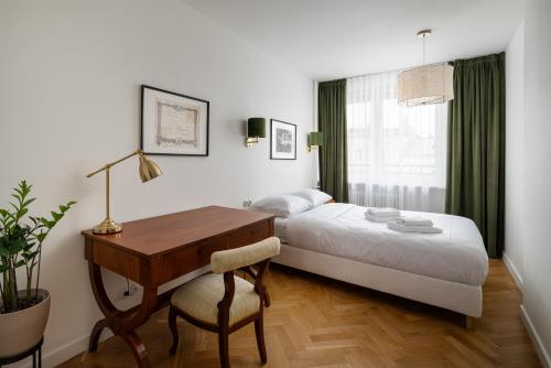 Posteľ alebo postele v izbe v ubytovaní Kopernika City Centre Apartment