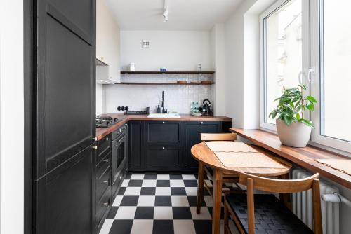 Kuchyňa alebo kuchynka v ubytovaní Kopernika City Centre Apartment