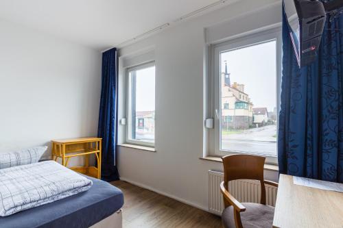 Postel nebo postele na pokoji v ubytování Pension für Monteure in Leipzig