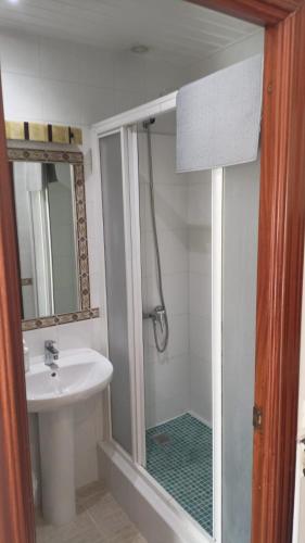 a bathroom with a shower and a sink and a shower at SERVILUX 4 in Torremolinos