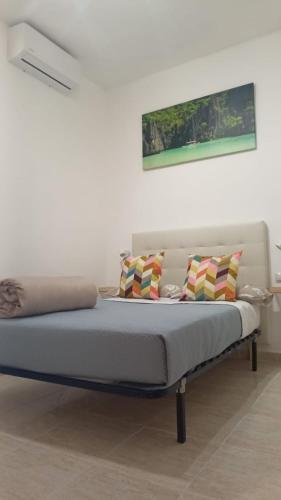 a bed with two pillows on it in a room at SERVILUX 4 in Torremolinos