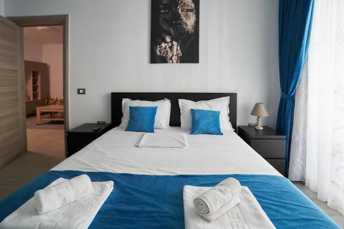 En eller flere senge i et værelse på Bianca Residence 2 by Alz