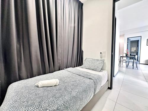 a bedroom with two twin beds and a window at New 2BR or 3BR Homey Getaway stay 7 to 10 pax at Urban Suites, Georgetown by URBAN STAYCATION LOD in Jelutong
