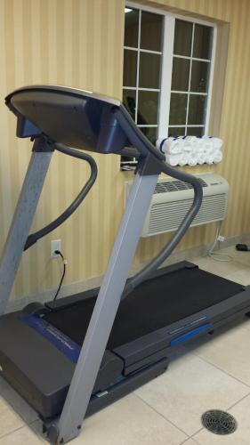 a treadmill in a room with a window at Cobblestone Inn & Suites - Brillion in Brillion