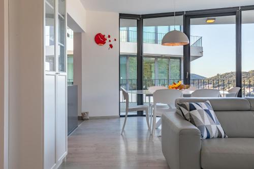 a living room with a couch and a table at Korcula Luxury Apartments in Korčula
