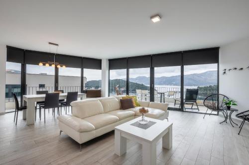 a living room with a couch and a table at Korcula Luxury Apartments in Korčula