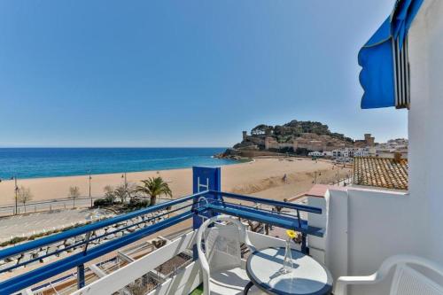 a balcony with a view of the beach at Hotel Corisco in Tossa de Mar