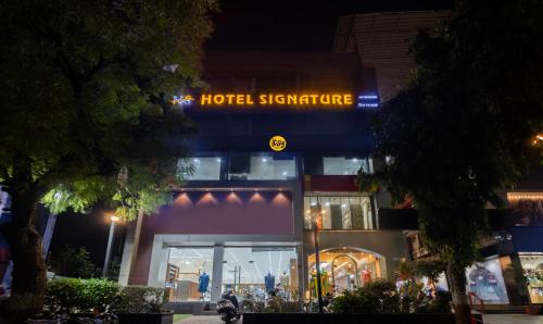 a hotel signature sign on the front of a building at Itsy By Treebo - Signature, Nehru Nagar in Ahmedabad