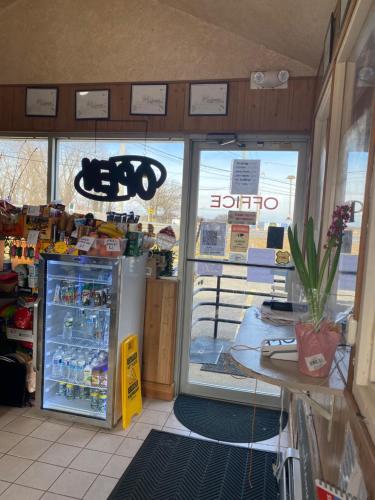 a store front with a refrigerator and a window at Tides Inn at Stehli Beach in Locust Valley