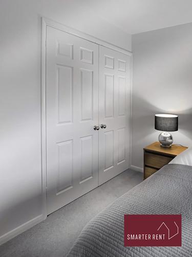 a bedroom with a white closet with a white door at Farnborough - Modern 2 Bedroom House in Blackwater