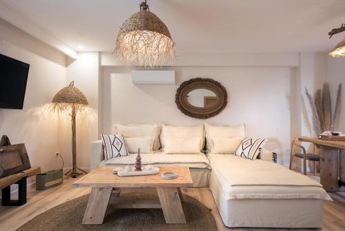 a living room with a couch and a table at EF apartment in Corfu Town