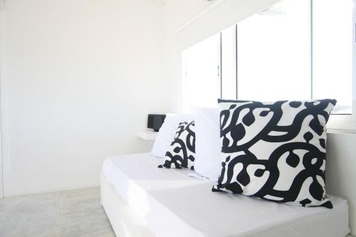 Ένα ή περισσότερα κρεβάτια σε δωμάτιο στο Ménage à Trois