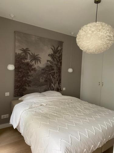 Postel nebo postele na pokoji v ubytování Cosy appartement 3min de Paris