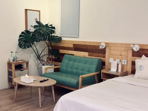 Postel nebo postele na pokoji v ubytování Yellow's Kenting B&B