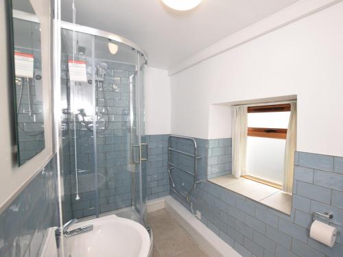 a bathroom with a toilet and a glass shower at 2 Bed in Aylesbeare THEDA in Aylesbeare