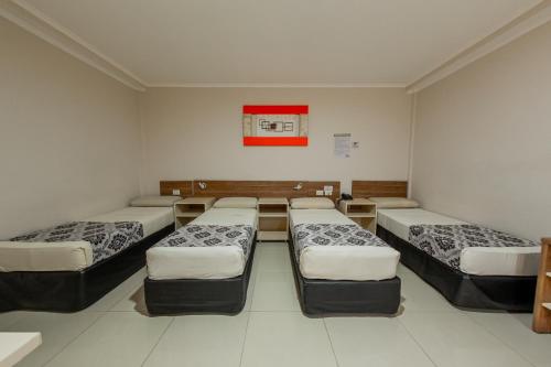Postel nebo postele na pokoji v ubytování Hotel Yvera Cataratas