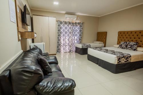 Postel nebo postele na pokoji v ubytování Hotel Yvera Cataratas