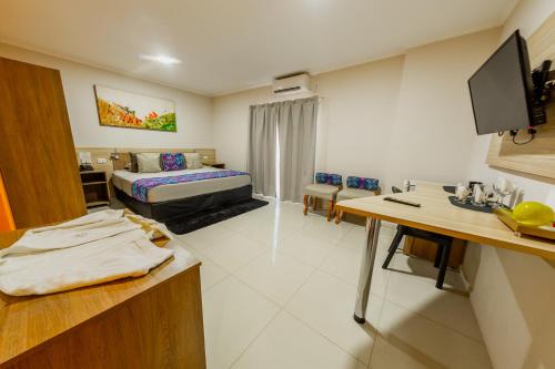 Postel nebo postele na pokoji v ubytování Hotel Yvera Cataratas