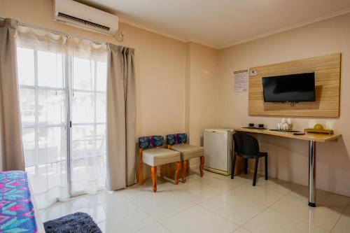 Kuchyň nebo kuchyňský kout v ubytování Hotel Yvera Cataratas