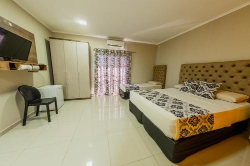 Postel nebo postele na pokoji v ubytování Hotel Yvera Cataratas