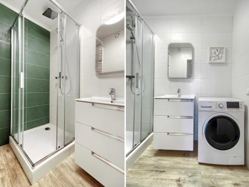 a bathroom with a washing machine and a washer at Platinium Zaspa - Pilotów 14 in Gdańsk