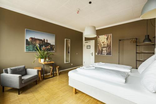 Postel nebo postele na pokoji v ubytování Five Reasons Hostel & Hotel
