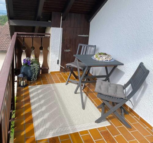 a patio with a table and chairs on a balcony at Engler-Fazekas in Bad Dürrheim