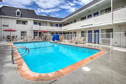 a pool at a hotel with chairs and tables at Motel 6-Fairfield, CA - North in Fairfield