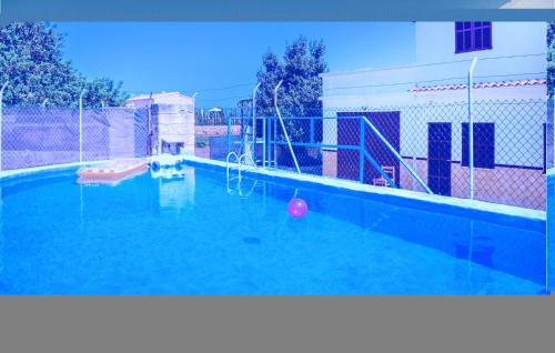 an empty swimming pool with a playground at 3 Bedroom Awesome Home In Porto Cristo in Porto Cristo