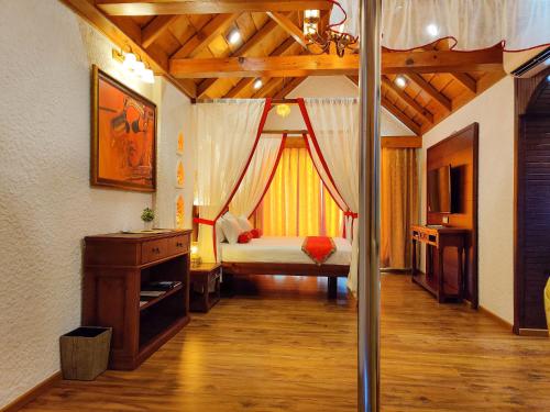 a bedroom with a bed with a canopy at Sherpa Retreat Resort in Padamchen
