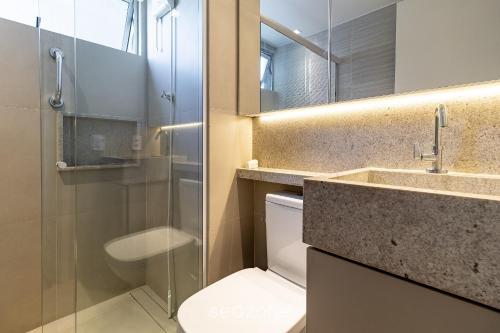 a bathroom with a toilet and a sink and a shower at Excelente apt em Maceio/AL 850m da praia ADV306 in Maceió