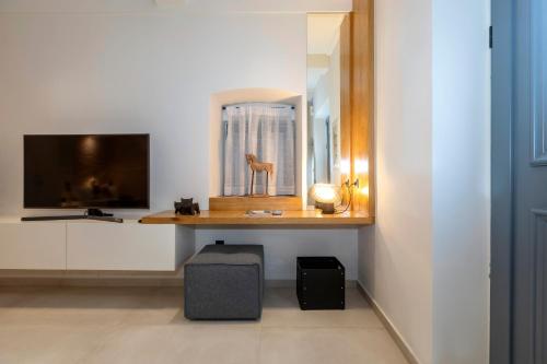 Télévision ou salle de divertissement dans l'établissement Dirapera Port Suite