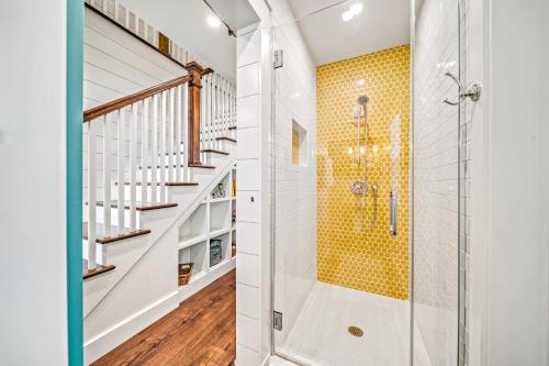 a bathroom with a shower and a staircase at Salty Sister - 302 in Anna Maria