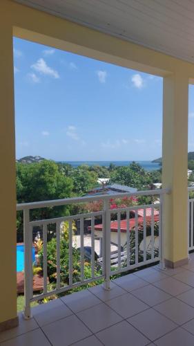 a view from the balcony of a house at F2 Vue sur mer La villa du manguier in Le Vauclin